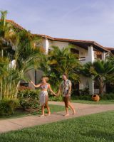 couple walking at sugar cane club barbados 